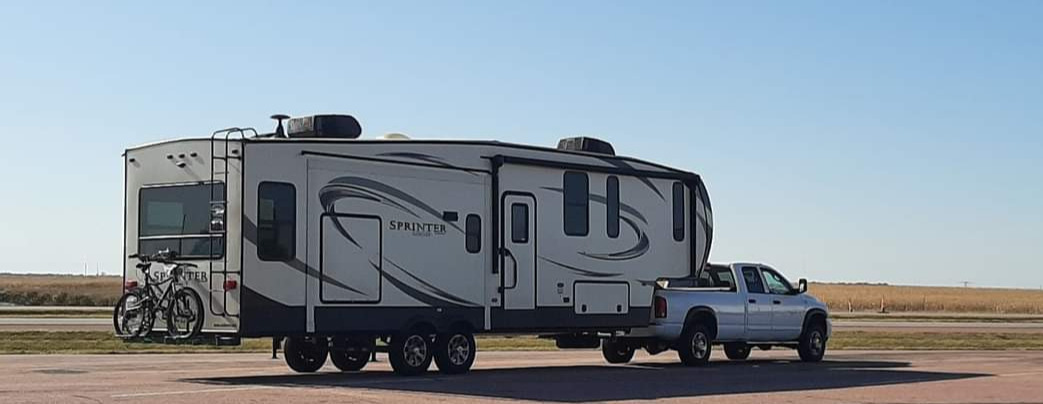 The MugGripz travel trailer and truck on the road